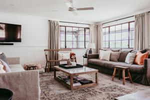 a living room with a couch and a table at Wandarra Homestead, Mudgee in Lue