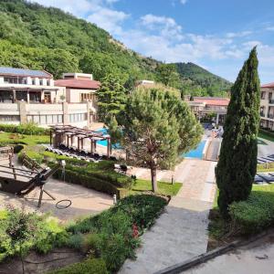 a view of a resort with a swimming pool at Modern 2BDRM in 5* Resort & pool in Sandanski