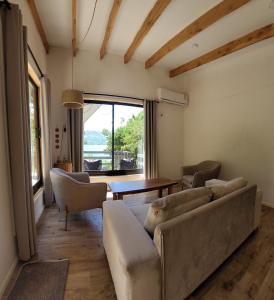 a living room with a couch and a table at Cabañas Llifenativo in Futrono