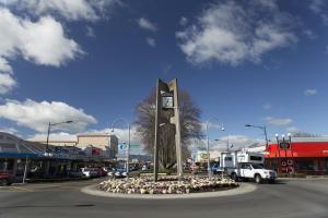 a clock tower in the middle of a street at Maple Lodge Motel in Matamata