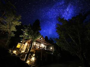 a house under a starry sky at night at Kurokawa Mori No Kiki in Minamioguni +98 photos