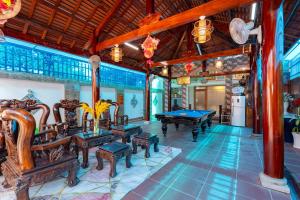 a room with a pool table and ping pong tables at Ngọc Thị Villa in Vung Tau