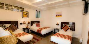 Tempat tidur dalam kamar di SACRED STONE Boutique Hotel