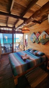 a bedroom with a bed with a view of the ocean at B & B MAGGY_BEACH in Playa Blanca