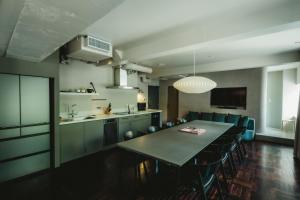 a kitchen and dining room with a table and chairs at THE KNOT TOKYO Shinjuku in Tokyo