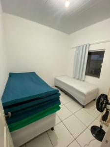 Ένα ή περισσότερα κρεβάτια σε δωμάτιο στο Casa praia alcobaca 3 quartos