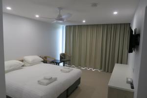 Tathra Hotel & Motel客房内的一张或多张床位