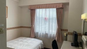 Postel nebo postele na pokoji v ubytování Hotel Alpha-One Sabae