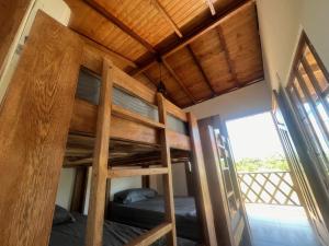 a bedroom with two bunk beds in a house at Cabaña El Cangrejo Azul - Blue Crab House in San Onofre
