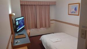 Postel nebo postele na pokoji v ubytování Hotel Alpha-One Tsuruga
