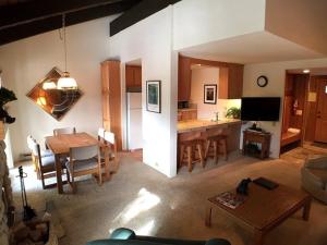 a kitchen and living room with a table and a dining room at Standard Condos with Free Parking in Mammoth Lakes