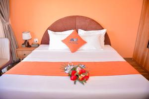 Postel nebo postele na pokoji v ubytování Sapa Legacy Hotel