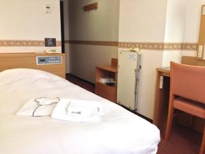 Postel nebo postele na pokoji v ubytování Hotel Alpha-One Tsuruga Bypass + 5 fotografií