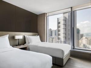 A bed or beds in a room at One96