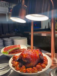 two plates of food with a turkey on a table at Wenjun Courtyard Hotel ---5 mins walk from Tonghuimen metro station, near Tianfu square, close by culture park and Sichuan opera house, English speaking service, local tours in Chengdu