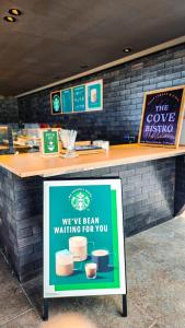 a sign in front of a counter in a store at Idyllic Concept Resort in Ko Lipe