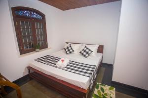 Ένα ή περισσότερα κρεβάτια σε δωμάτιο στο Villa RISITHENMI