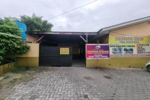 a building with a sign on the side of it at OYO 93493 Wira Residensia Syariah in Medan