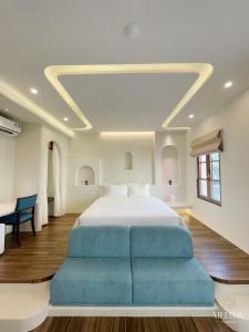 Postel nebo postele na pokoji v ubytování Mellon OASIS Phu Quoc