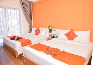 Postel nebo postele na pokoji v ubytování Sapa Legacy Hotel