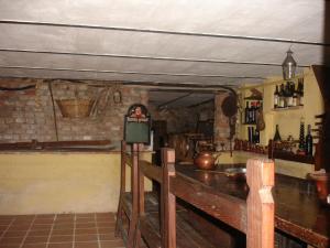 a room with a bar and a counter in a room at Cascina Ciosse B&B in Grognardo