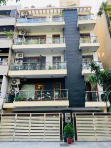 an image of a building with balconies at Fortune Home Service Apartment 4Bhk,J-191 Saket in New Delhi