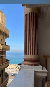a view of the ocean from the balcony of a building at Stanley Bridge apartment Alexandria in Alexandria