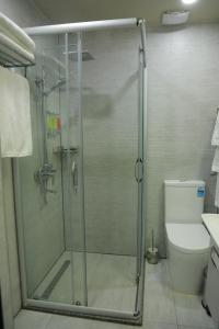 a shower stall in a bathroom with a toilet at Human Hotel in Tashkent +119 photos