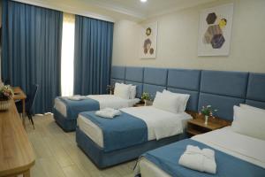 Postel nebo postele na pokoji v ubytování Human Hotel + 119 fotografií