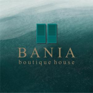 un logo pour une maison de caractère dans l'océan dans l'établissement Bania Boutique House, à Khao Lak