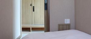 Postel nebo postele na pokoji v ubytování Hotel tt Gupo
