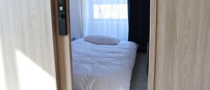 Postel nebo postele na pokoji v ubytování Hotel tt Gupo