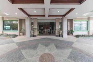 a lobby of a building with a large building at Hotel ayong Linggarjati Kuningan Mitra RedDoorz in Kuningan