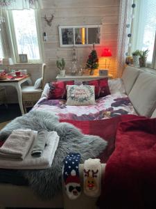 a bedroom with a bed with christmas socks on it at Guest House Marjala in Kotka