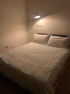 Cama o camas de una habitación en PlainStay Hostel