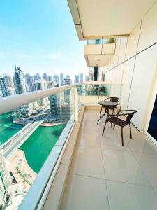 an apartment balcony with a view of the city at Lux High Rise Marina Apartment in Dubai