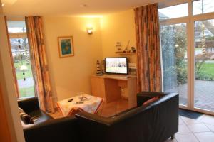 TV a/nebo společenská místnost v ubytování 4 Sterne Apartment Hühnergott mit Terrasse und Sauna