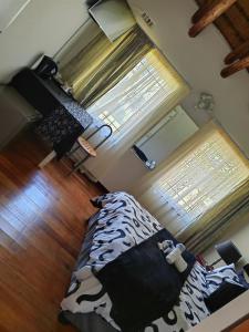 an aerial view of a room with a bed and a window at Emfuleni Boughton Inn in Pietermaritzburg