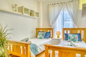 Ένα ή περισσότερα κρεβάτια σε δωμάτιο στο Ideal Property Mallorca - Casa Maylin