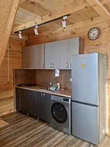 Kuchyň nebo kuchyňský kout v ubytování Cottage SuBree on Goderdzi
