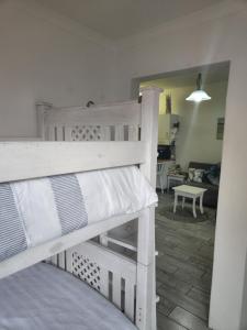 a bunk bed in a room with a living room at Sea Scapes Holiday Apartment in Margate