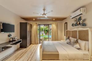 מיטה או מיטות בחדר ב-Le dando Beach Resort by Orion Hotels