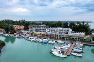 a group of boats docked in a harbor at Hotel Yacht Wellness & Business in Siófok