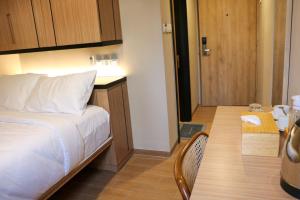 Postel nebo postele na pokoji v ubytování Grand Ametis Hotel Jakarta + 29 fotografií