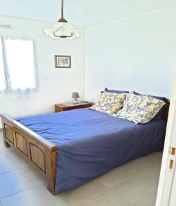 A bed or beds in a room at Gite du Clos Martin