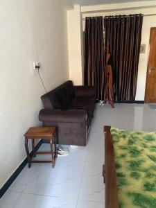 a living room with a couch and a coffee table at Murree Oaks Tulip Block in Murree