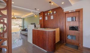 a lobby with a reception desk in a building at Treebo Trend The Northern Retreat Resort With Mountain View in Shimla