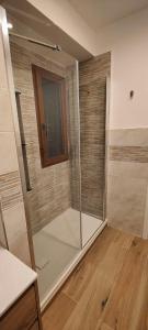 a shower with a glass door in a room at Affittacamere Le Vele in Genoa +8 photos