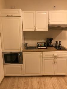 Kuchyň nebo kuchyňský kout v ubytování Fiore 76 Gästezimmer