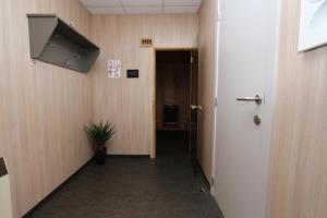 a hallway of an office with a door and a plant at Ferienhaus Moselgasse in Zell an der Mosel